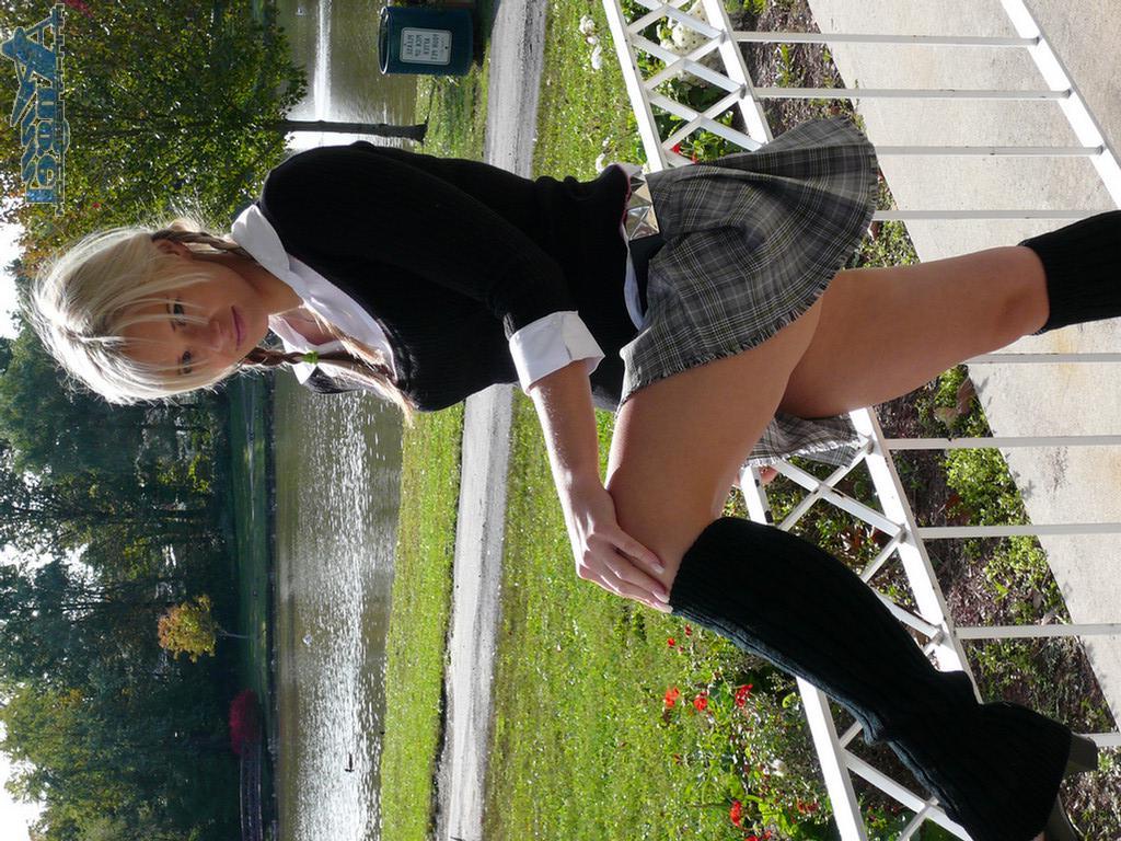 16P Ann Angel exposes her tits in a park