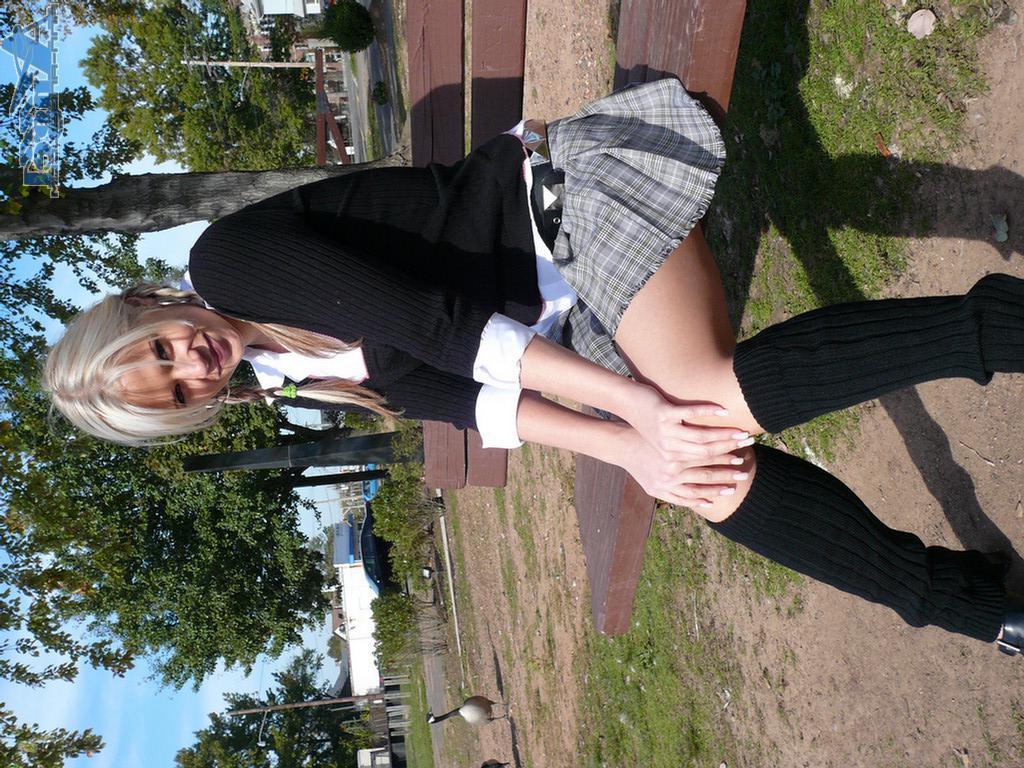 16P Ann Angel exposes her tits in a park