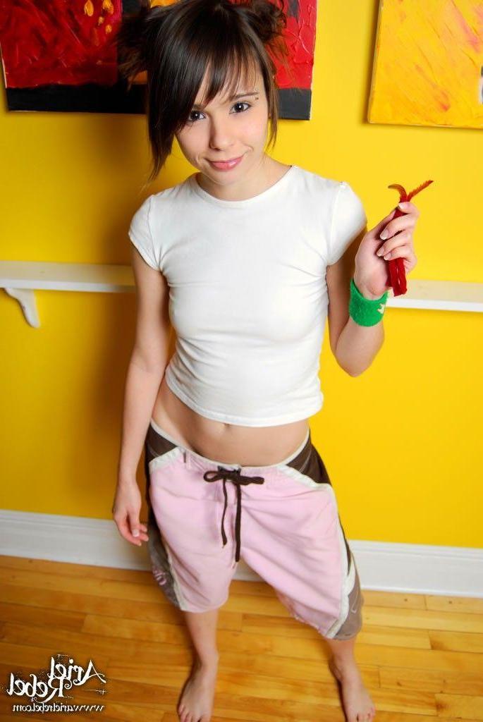 20P Pictures of teen slut Ariel Rebel stripping naked with licorice