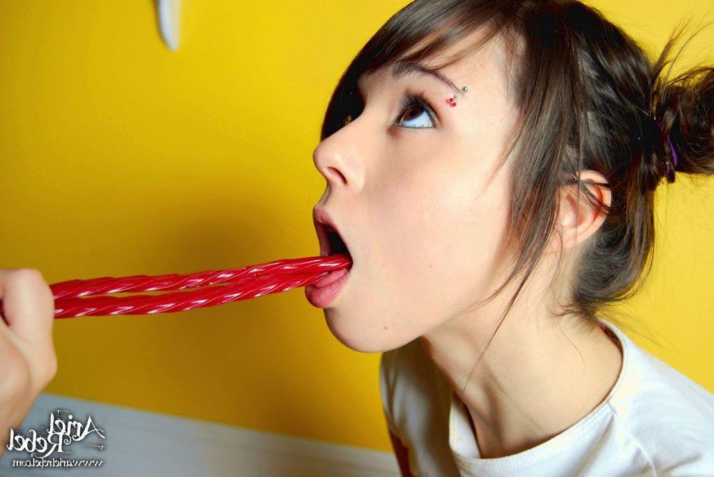 20P Pictures of teen slut Ariel Rebel stripping naked with licorice
