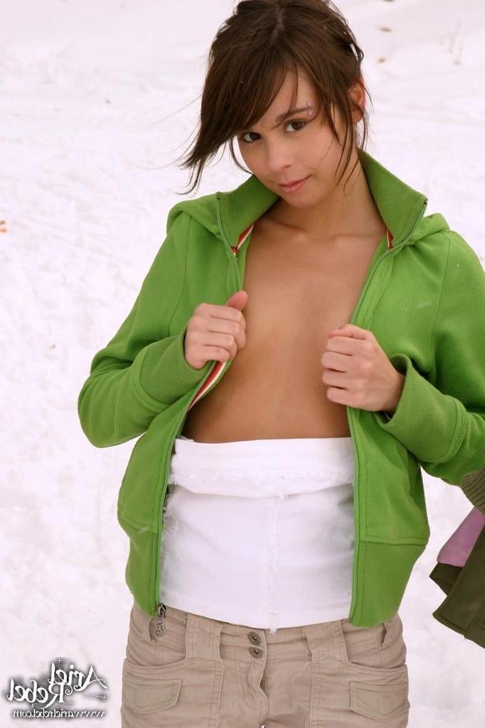 15P Pictures of Ariel Rebel flashing her tits in the snow