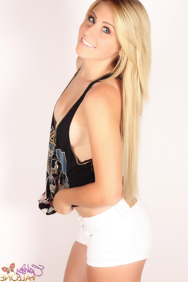 20P Ashley Vallone flaunts her beauty in a black tank top and white shorts