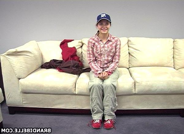 16P Pictures of teen model Brandi Belle stripping on the couch