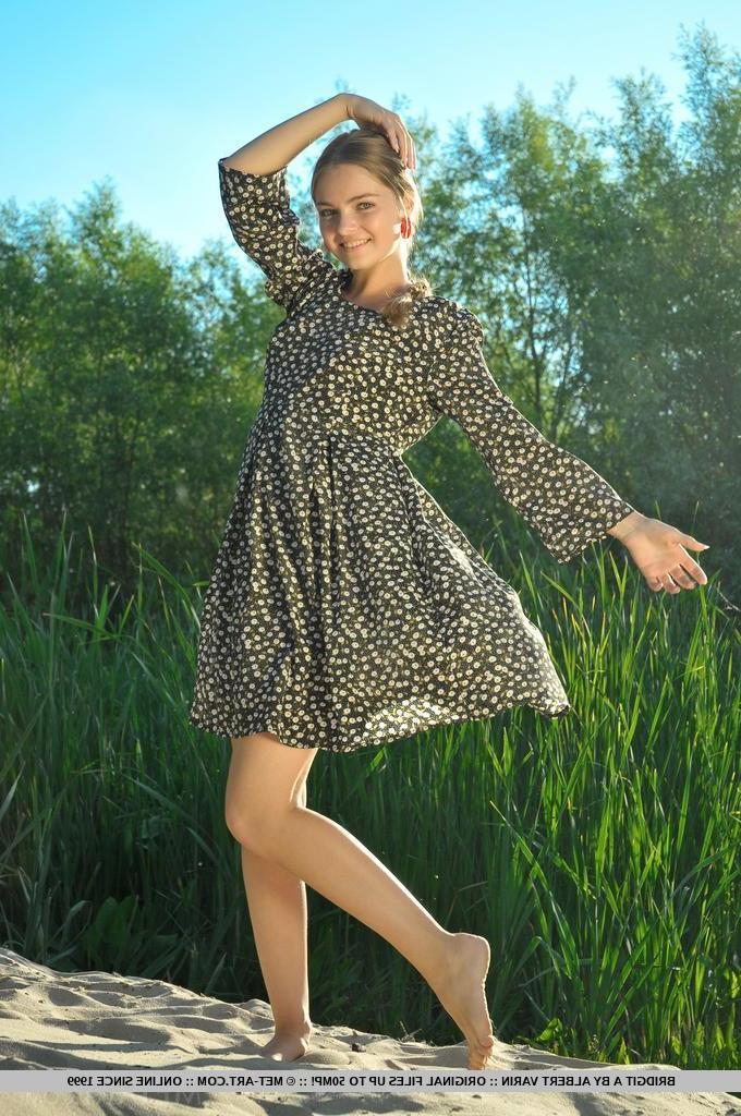 18P Blonde teen Bridgit A exposes her tight body outside