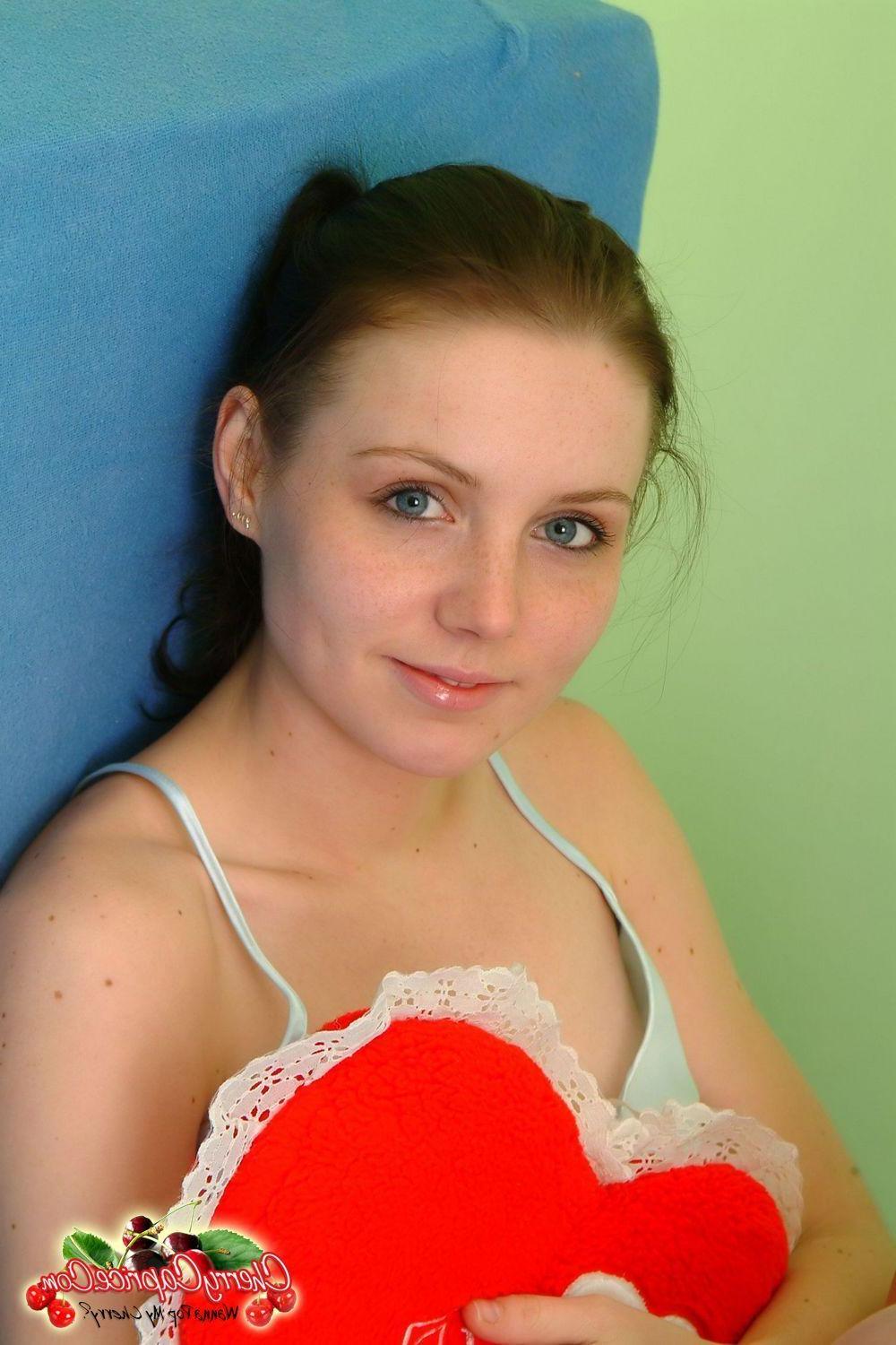 20P Pictures of teen star Cherry Caprice getting naked in bed