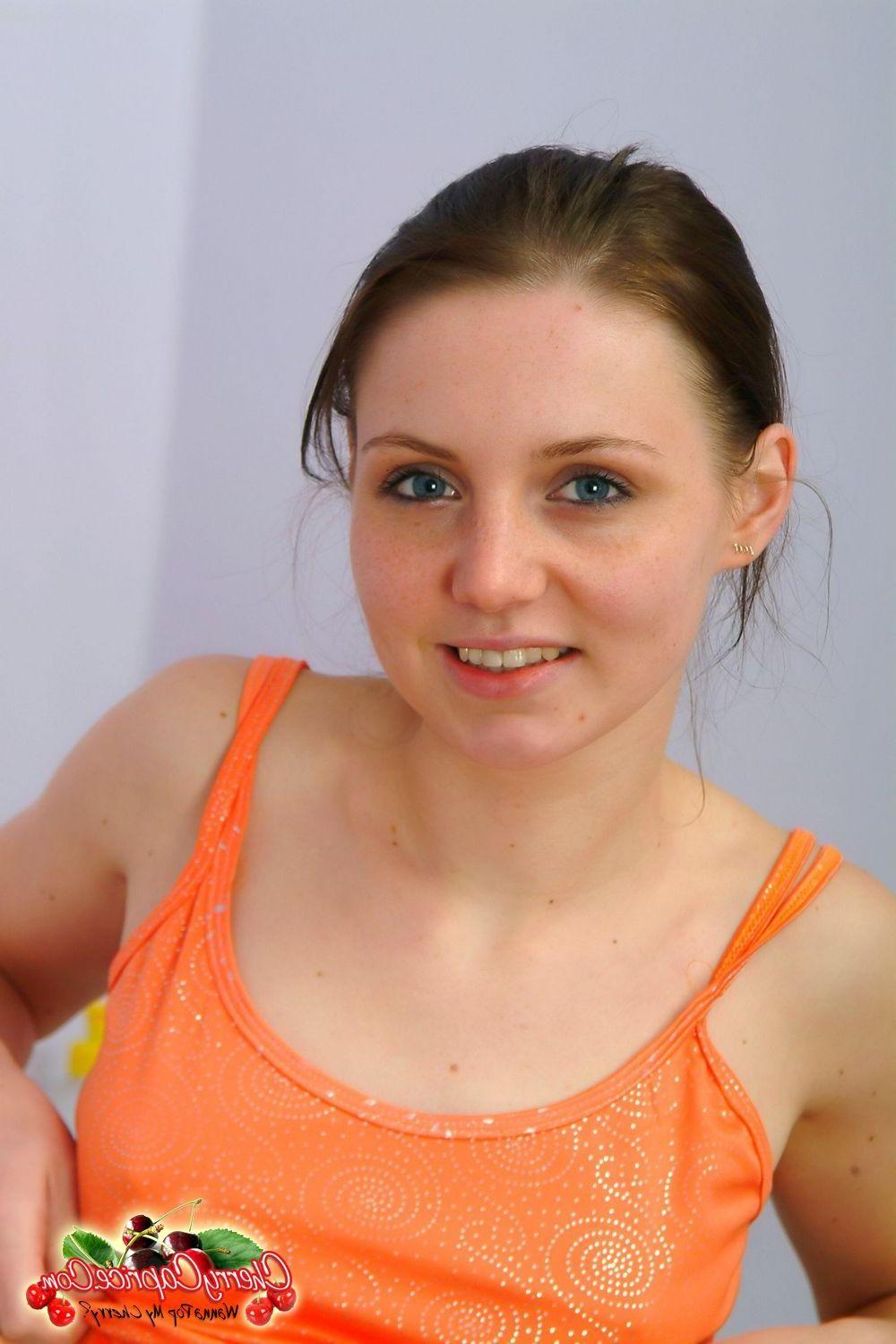 20P Pictures of teen slut Cherry Caprice wearing only her panties in the kitchen