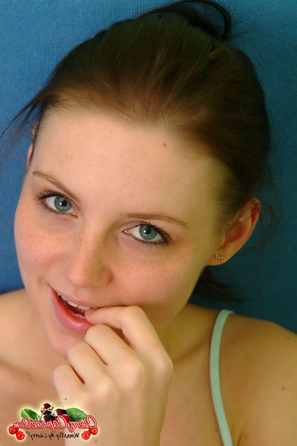 20P Pictures of Cherry Caprice stripping nude for you in bed