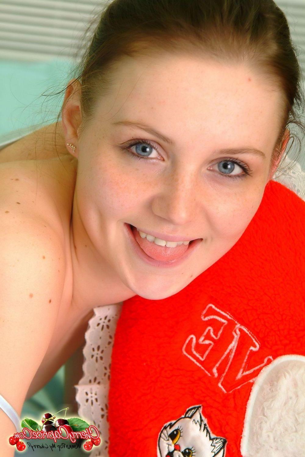 20P Pictures of Cherry Caprice stripping nude for you in bed