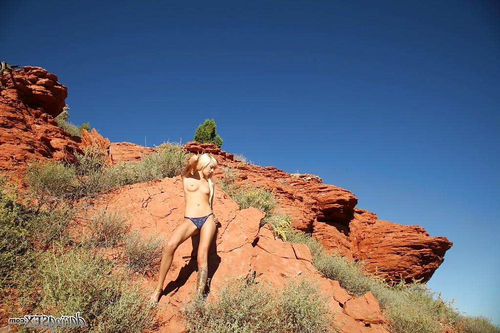 16P Graceful blonde Emma Mae stripping off her top and panties outdoor