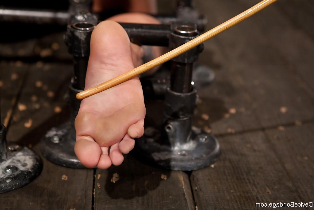 16P Thick blonde chick Holly Heart having bare feet caned in bondage