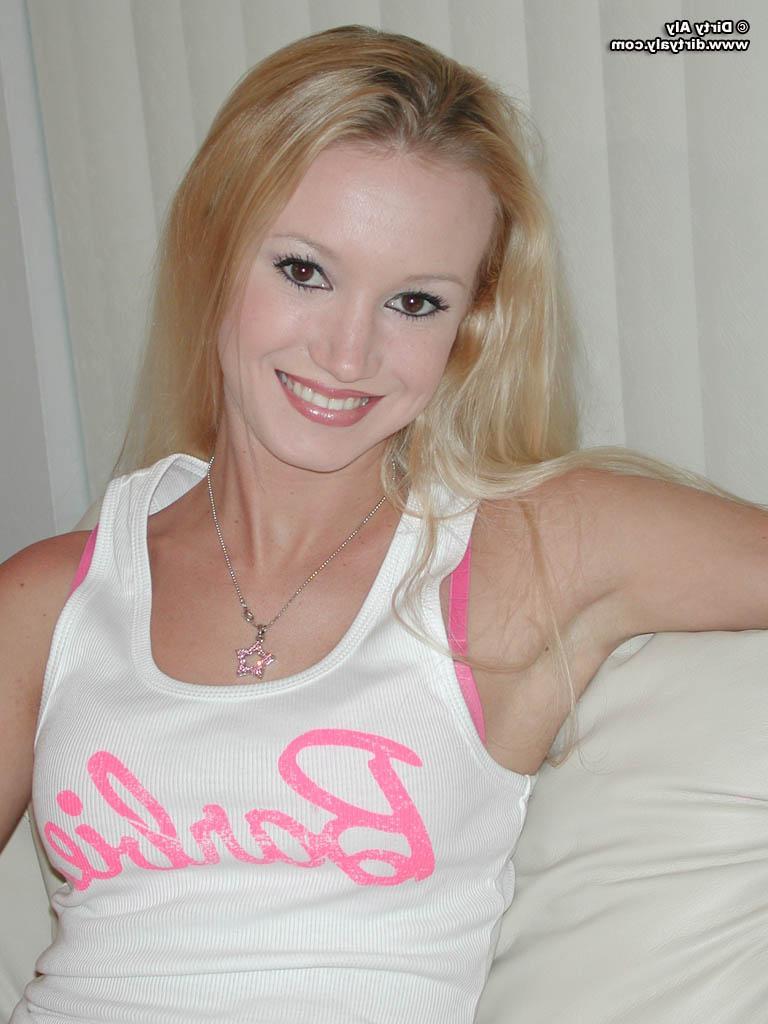 20P Pictures of Dirty Aly exposing her tits on the couch