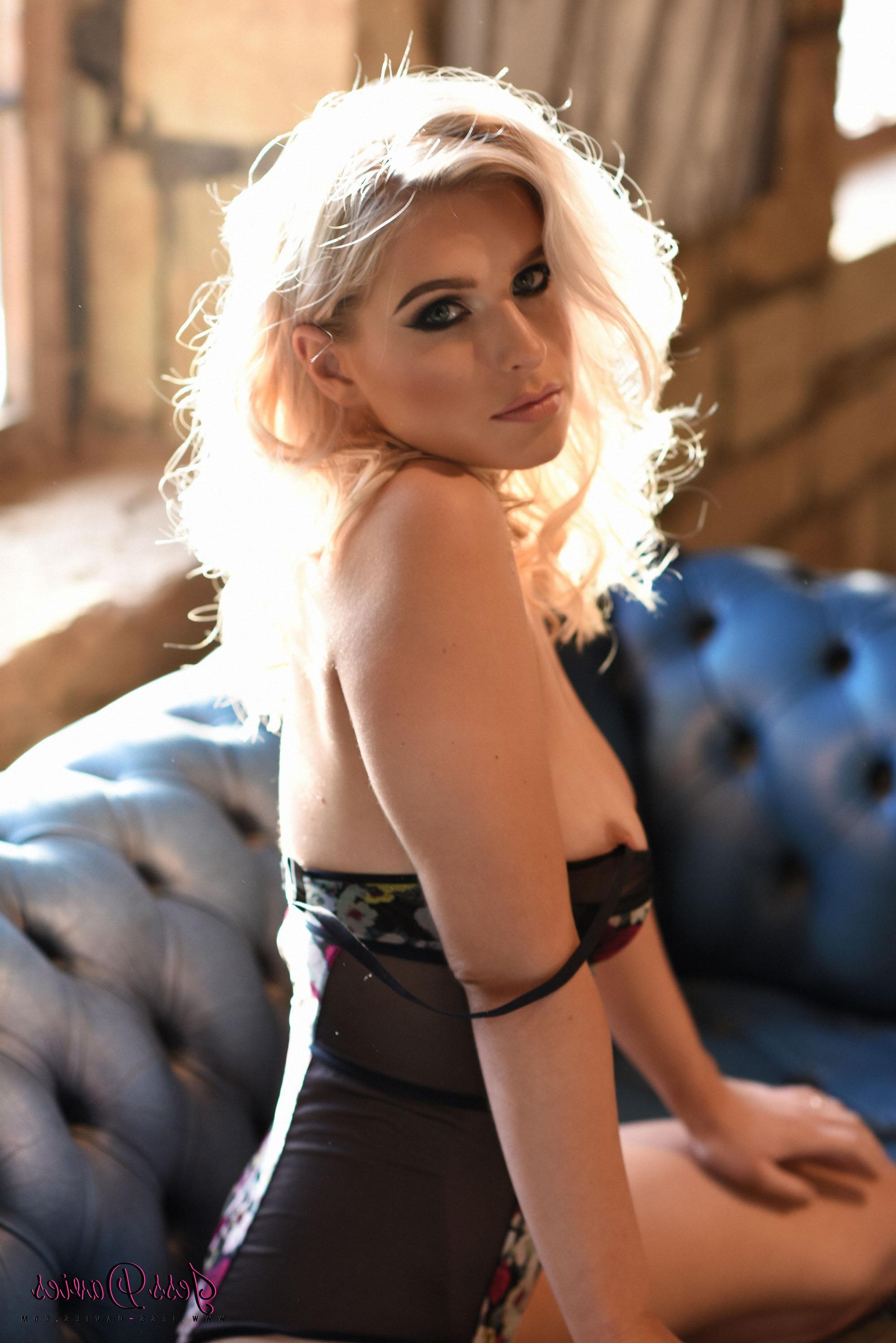 16P Jess Davies teasing on the sofa in her bodysuit