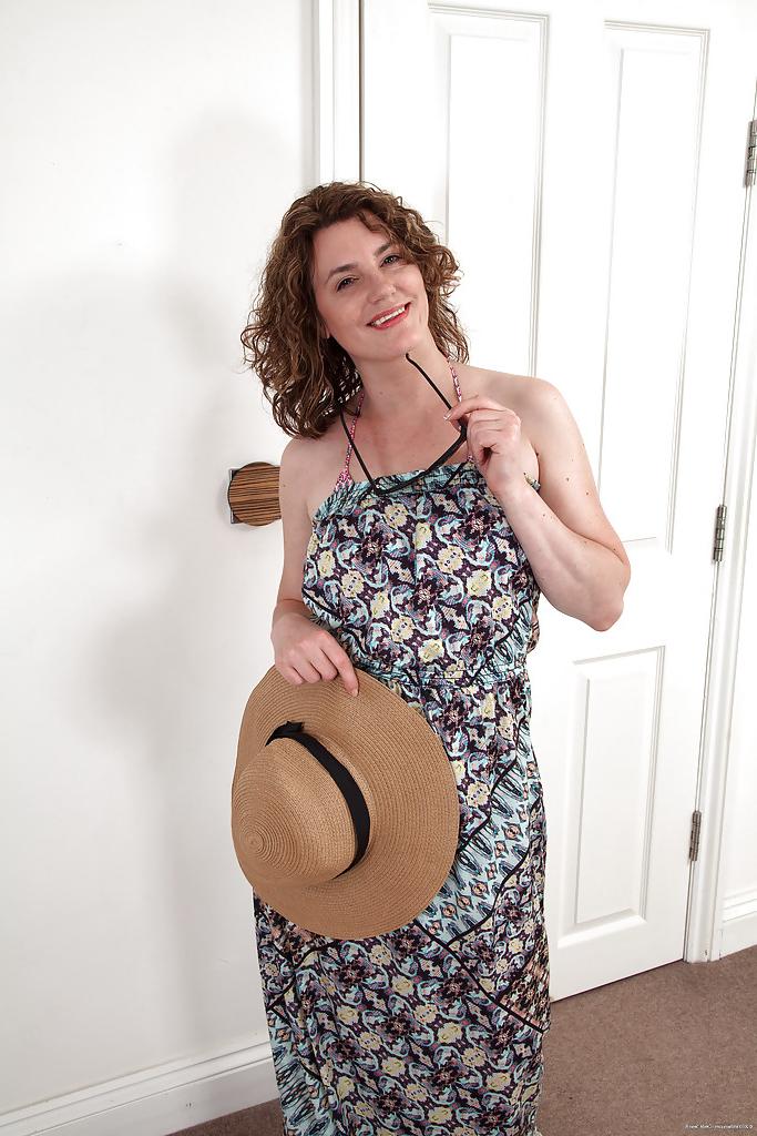 16P Sassy MILF gets rid of her dress and bikini to expose her shaggy cooter