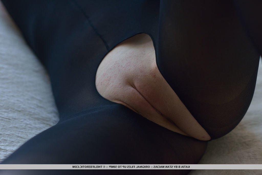 16P Katia B strips her see-through body tights as she masturbates on the bed