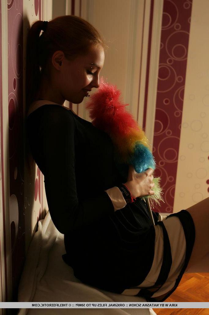 16P Redhead model Kira W gets horny while cleaning the house