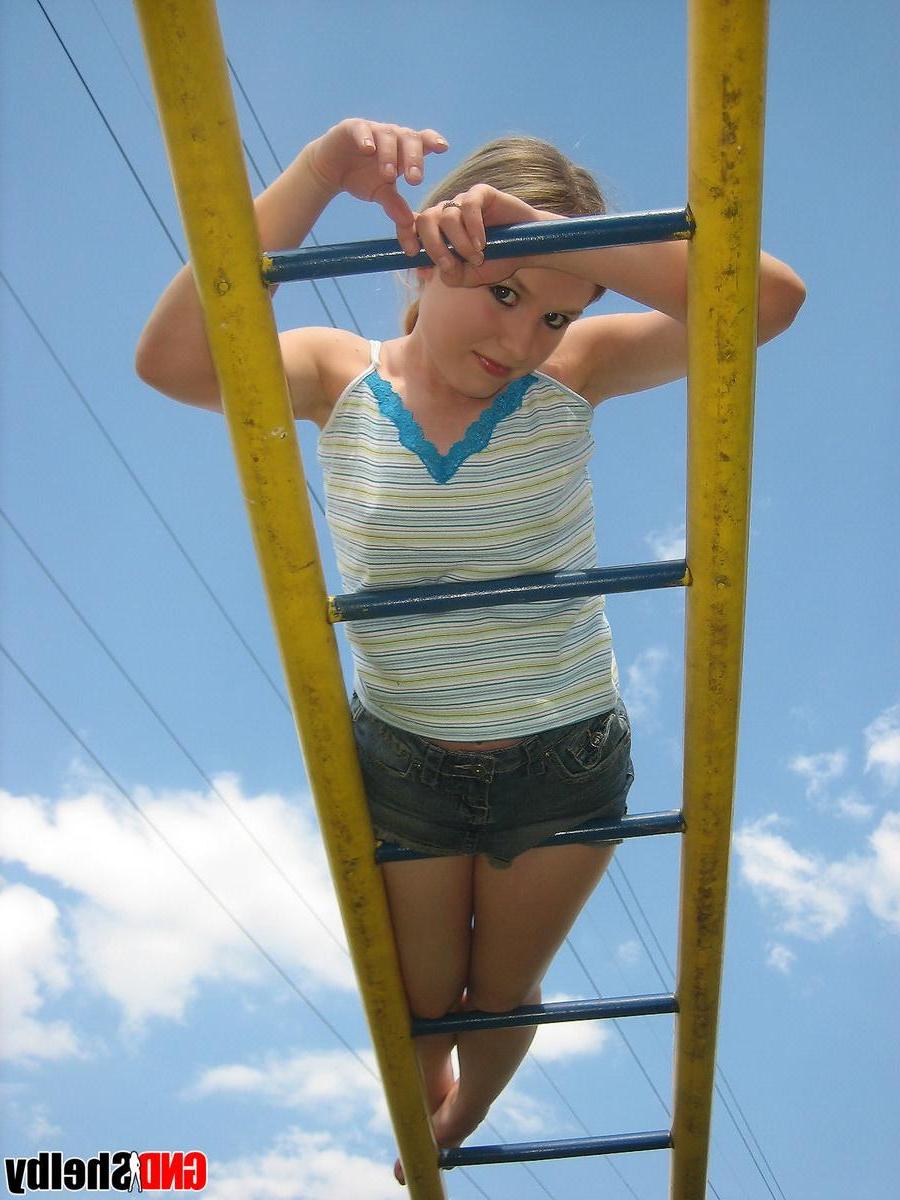 12P Perky girl next door Shelby shows off her perfect teenage breasts in the park on the jungle gym