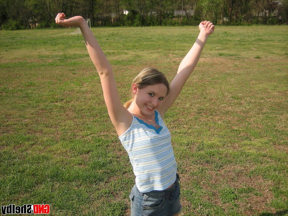 12P Perky girl next door Shelby shows off her perfect teenage breasts in the park on the jungle gym