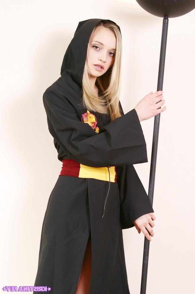 15P Pictures of teen girl Kristina Fey teasing from behind a trench coat