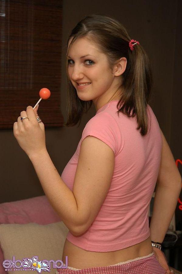 20P Pictures of teen cutie Lana Brooke putting something hard in her mouth