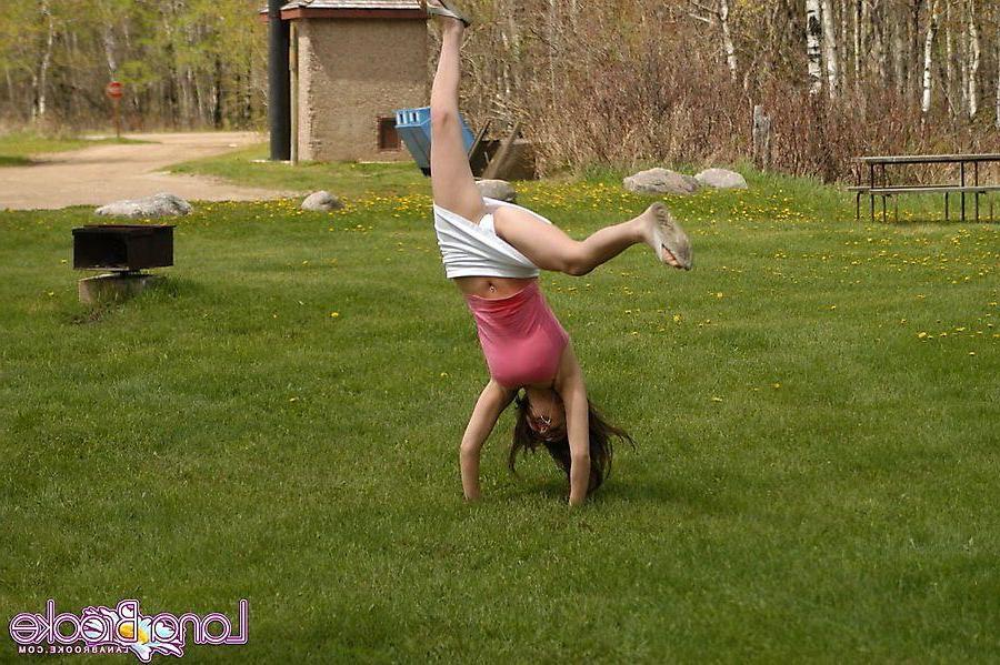20P Pictures of teen chick Lana Brooke flashing her tits outside