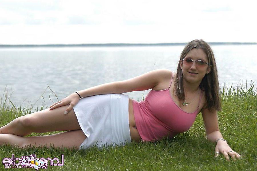 20P Pictures of teen chick Lana Brooke flashing her tits outside