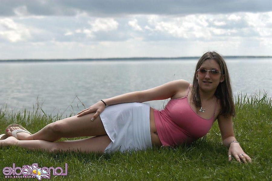 20P Pictures of teen chick Lana Brooke flashing her tits outside