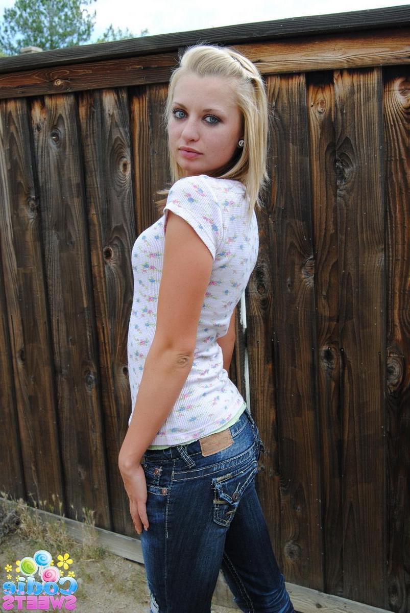 12P Perky blonde tease Codie Sweets flashes her tits as she strips naked outside