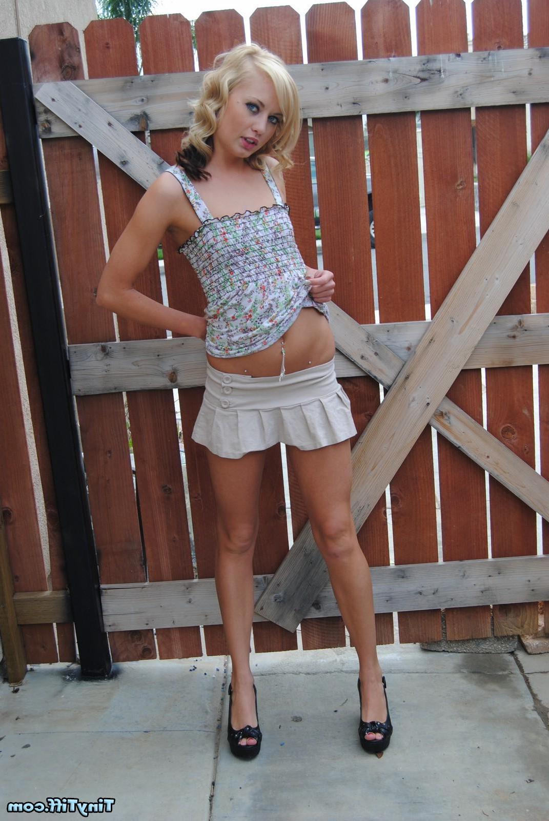 16P Stunning blonde teen Tiny Tiff pulls up her beige skirt to show off her sexy ass