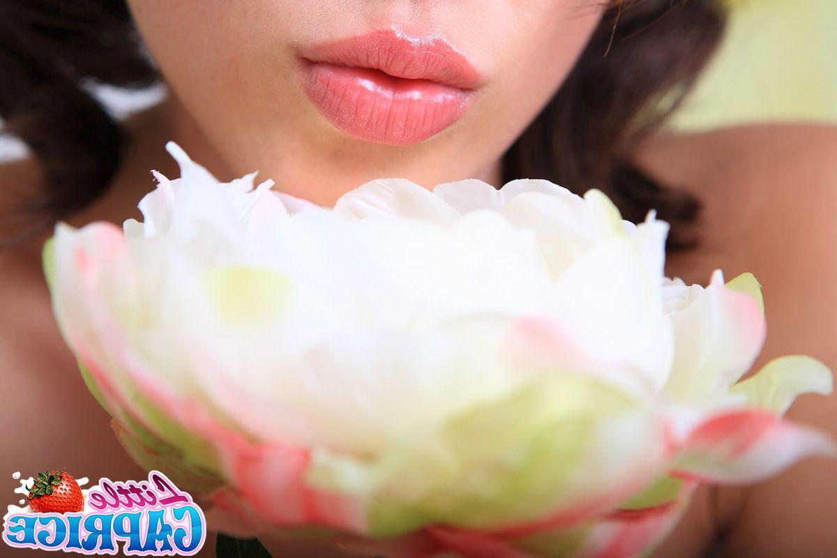 12P Pictures of teen Little Caprice fucking a glass dildo on the couch