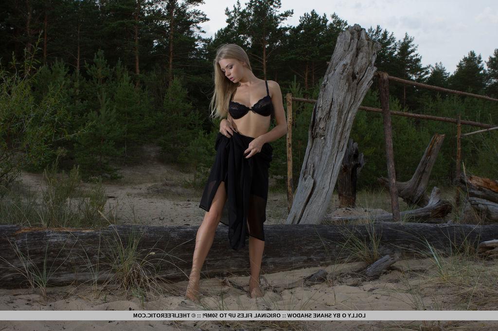 16P Busty blonde teen Lolly O has some fun with her pussy in the sand