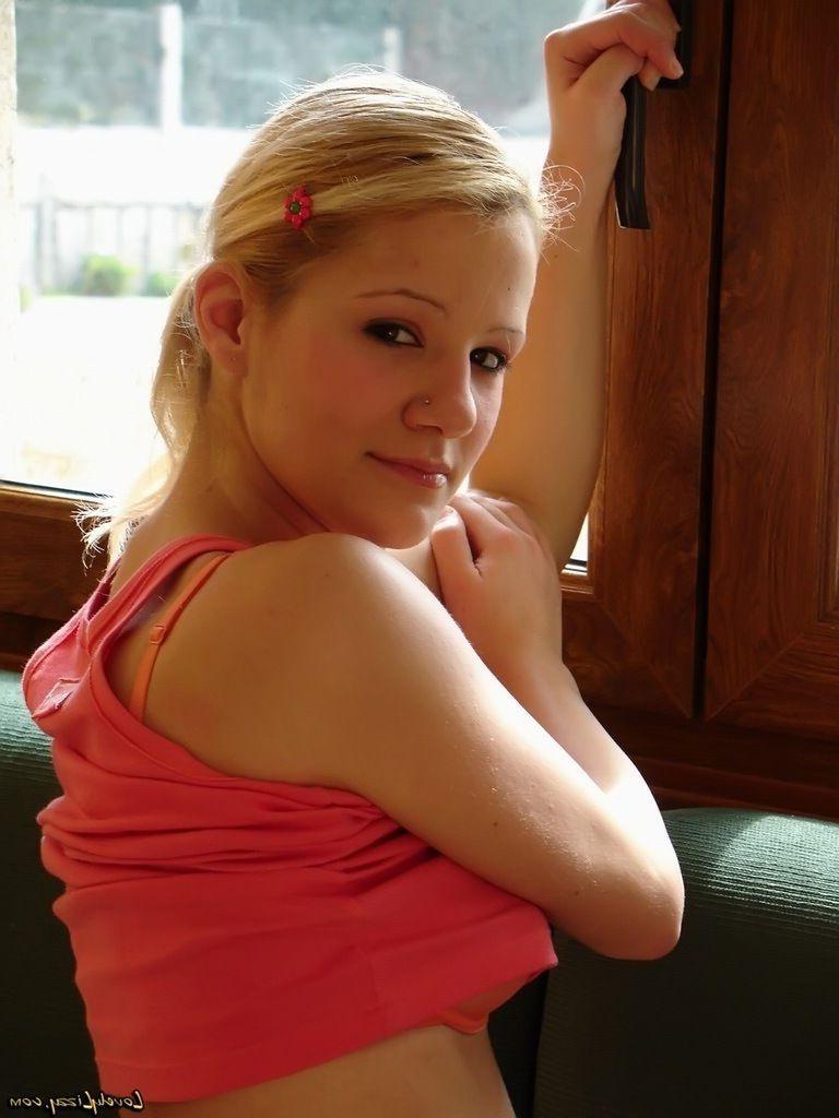 16P Pictures of teen nympho Lovely Lizzy sprawled out on the couch