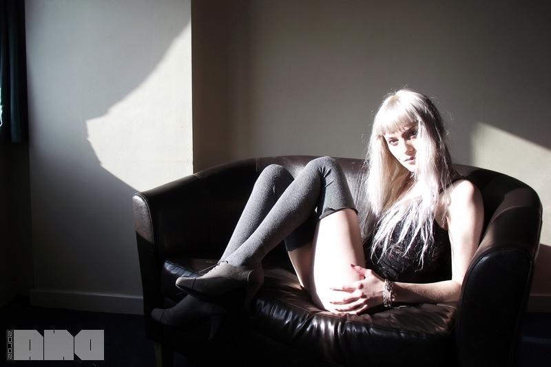 15P Pretty pinup Lovisa Grey flashes her pierced nipples on the couch