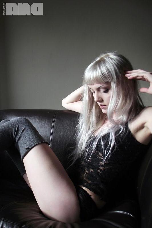 15P Pretty pinup Lovisa Grey flashes her pierced nipples on the couch