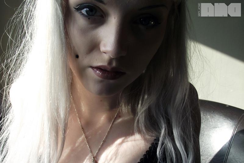 15P Pretty pinup Lovisa Grey flashes her pierced nipples on the couch