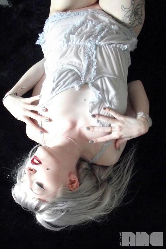 15P Beautiful alt girl Lovisa Grey looks up at you while she strips