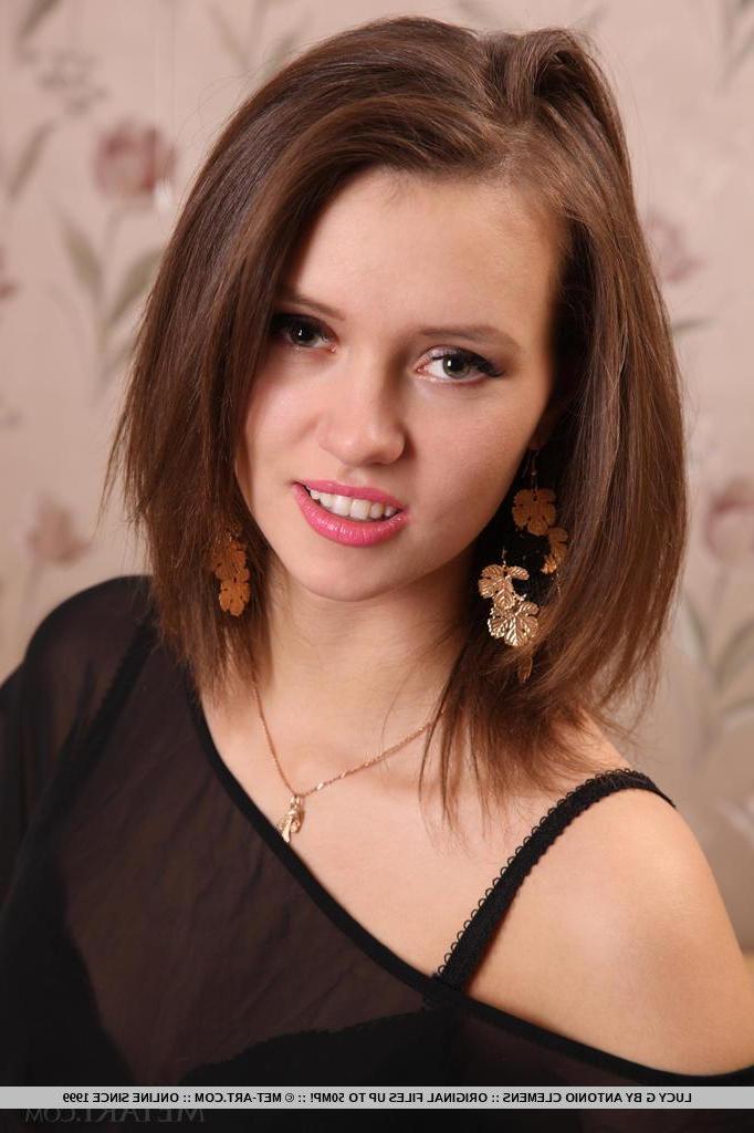 18P After a fun and playful striptease Lucy C lays down on the down and starts flirting with the camera