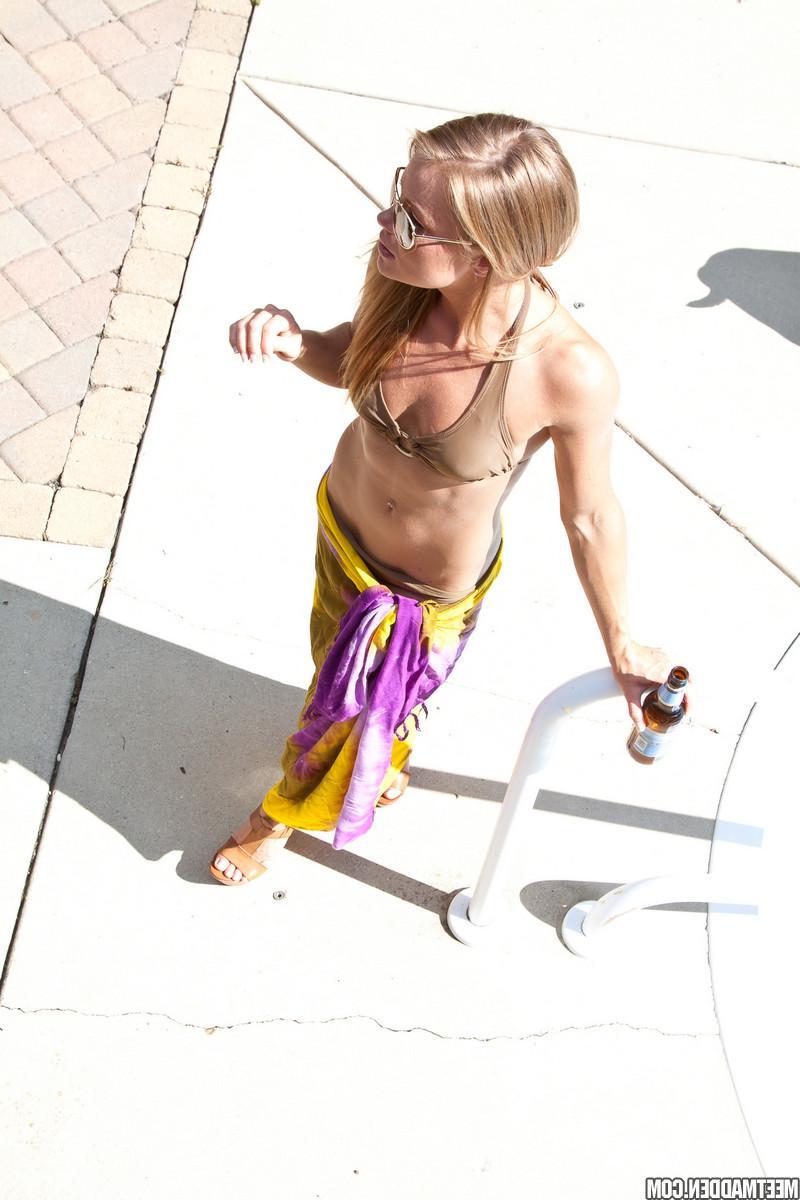 15P Blonde babe Madden strips and plays by the pool