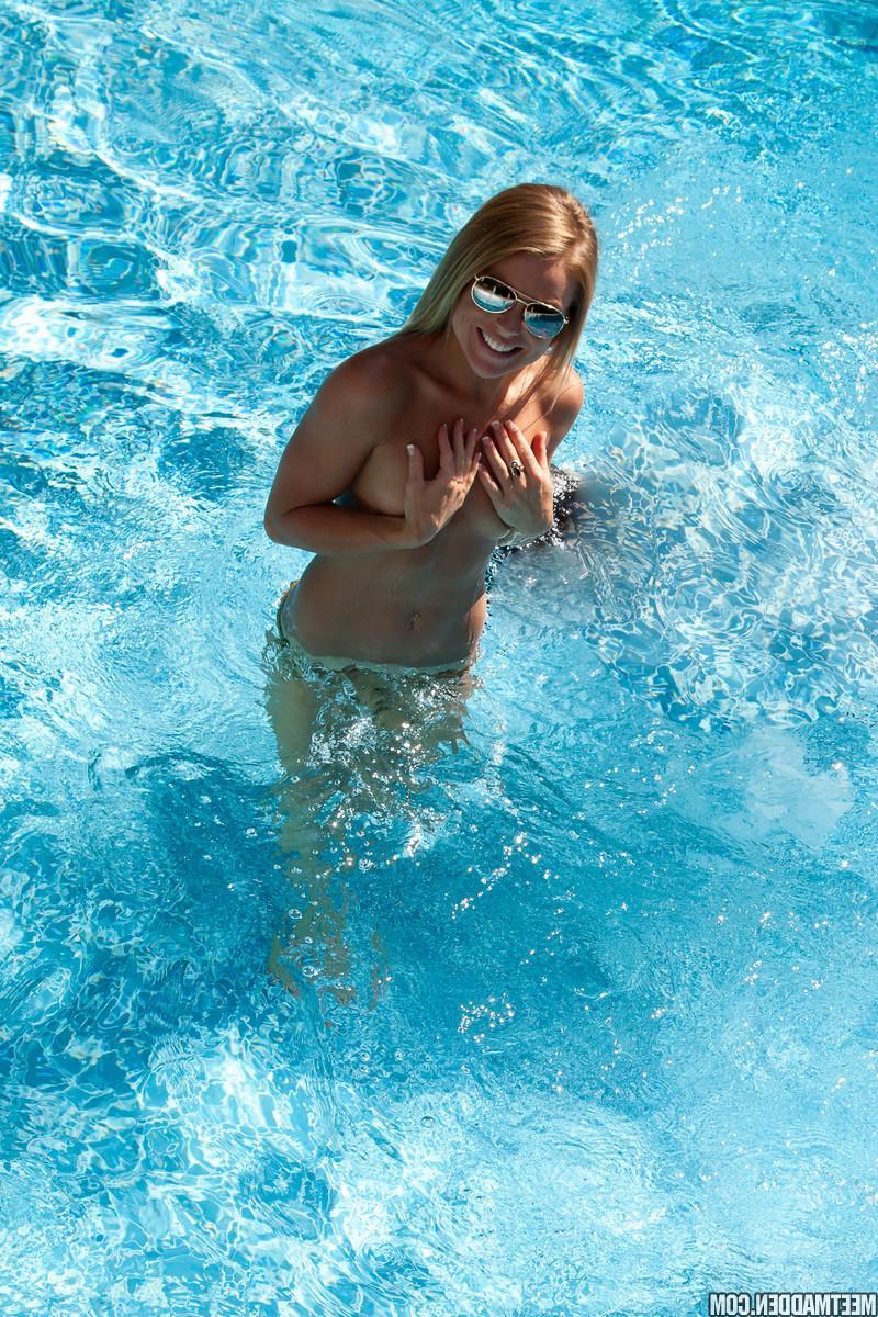15P Blonde babe Madden strips and plays by the pool