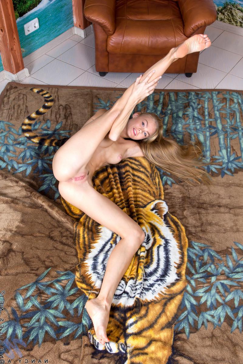 15P Long legged model Nancy A shows off her naughty side as she masturbates
