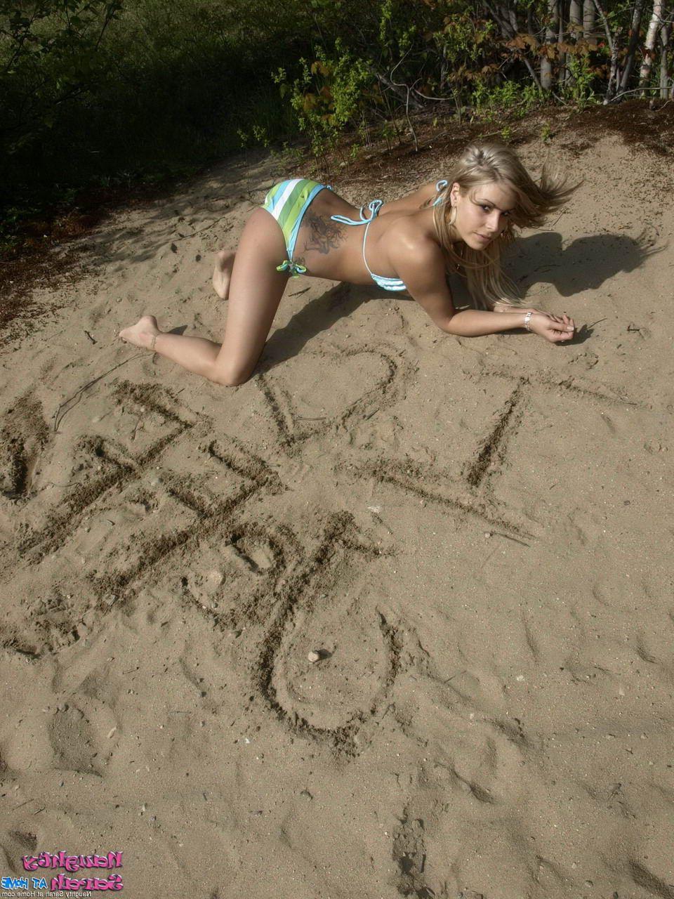 15P Pictures of teen Naughty Sarah being naughty on a beach