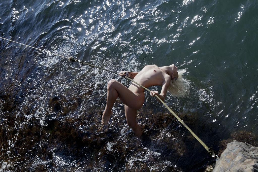 16P Blonde teen Nika N goes for a nude swim in "Siren"