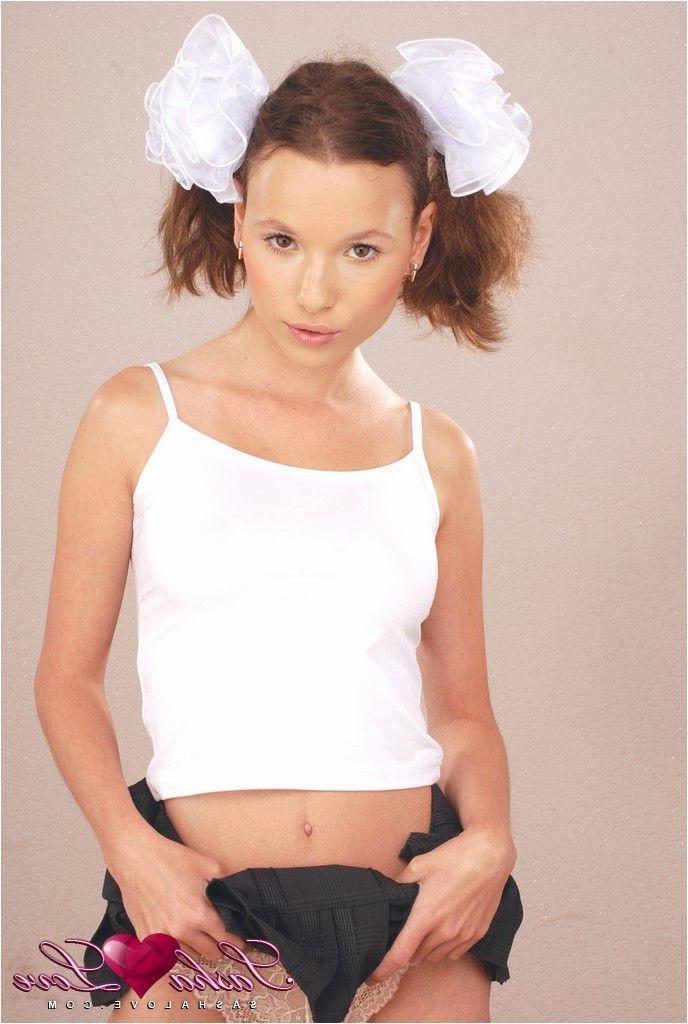14P Pictures of teen Sasha Love dressed as a catholic schoolgirl