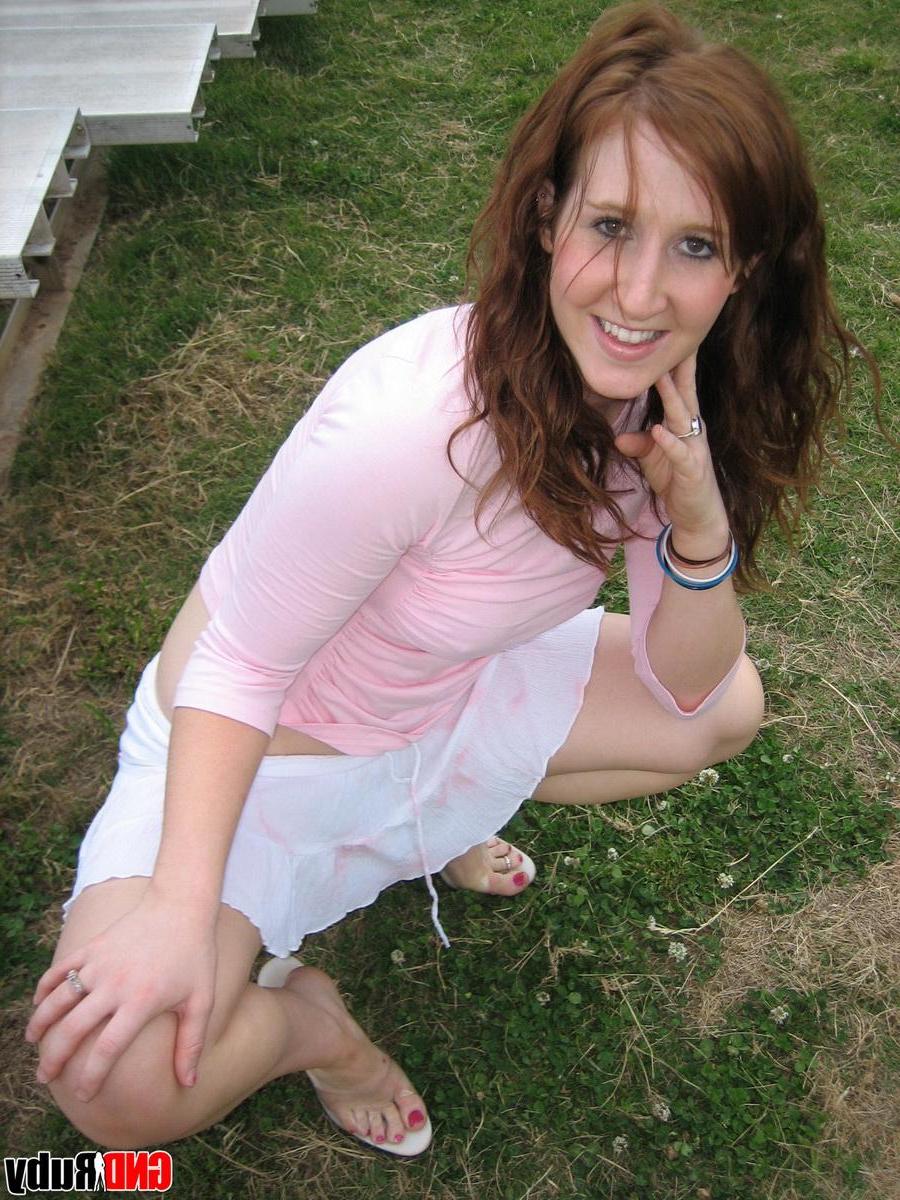 12P Super cute redhead teen Ruby teases on the park bleachers showing off her tight white panties