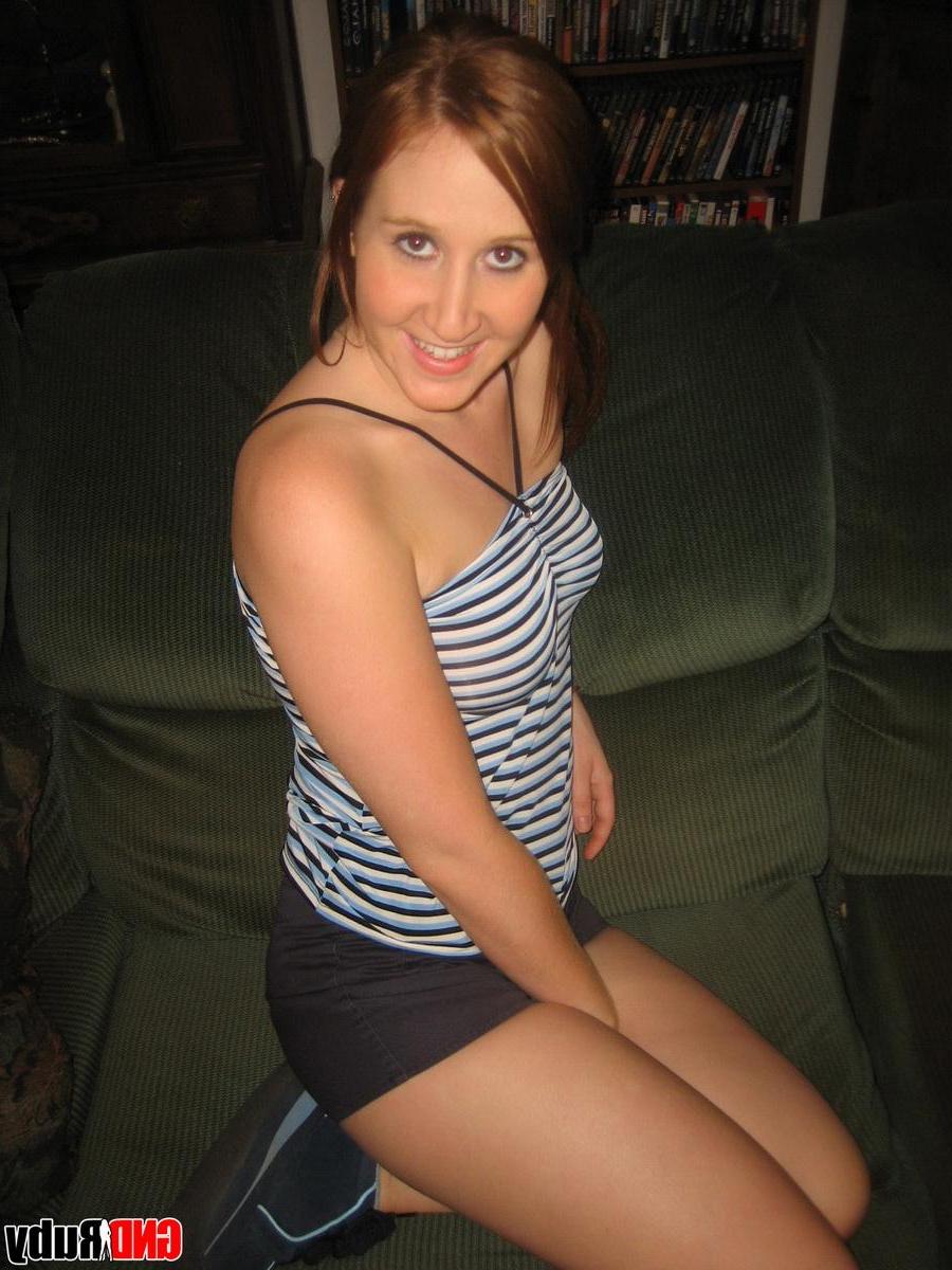 12P Horny redhead Ruby strips out of her Superman panties and starts to finger her wet pussy