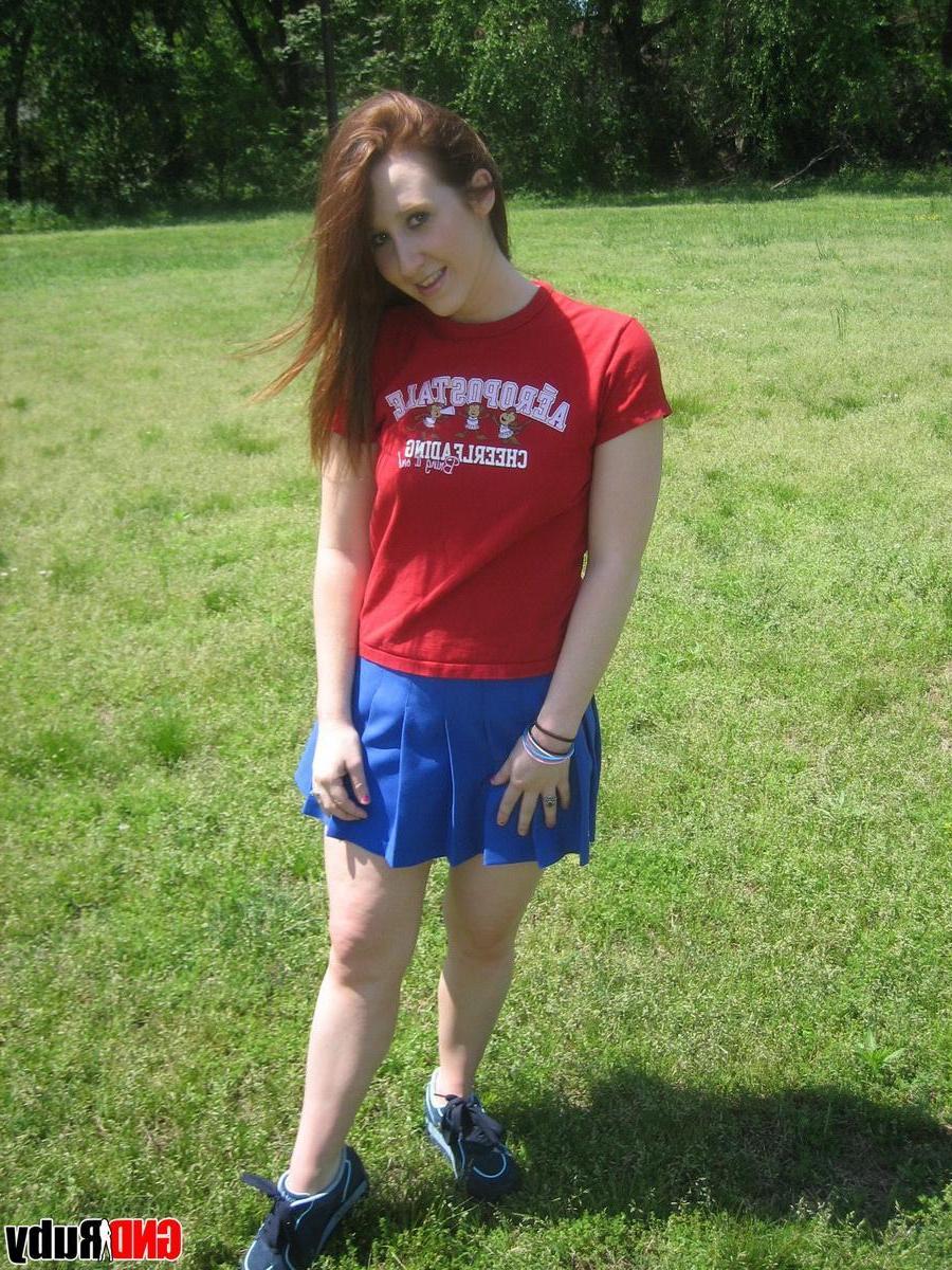12P Teenage slut Ruby flashes her perky tits out in the park while picking flowers