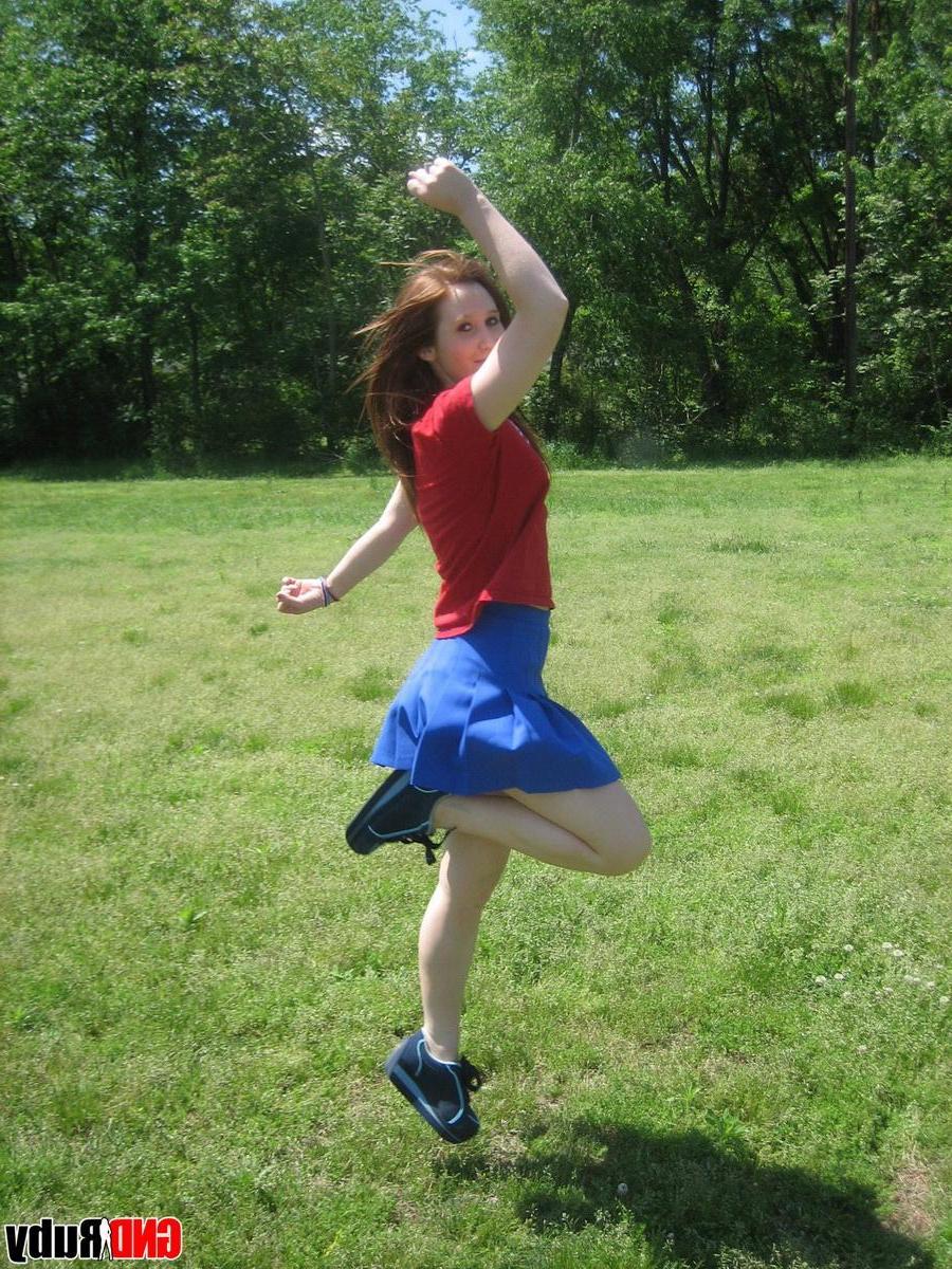 12P Teenage slut Ruby flashes her perky tits out in the park while picking flowers