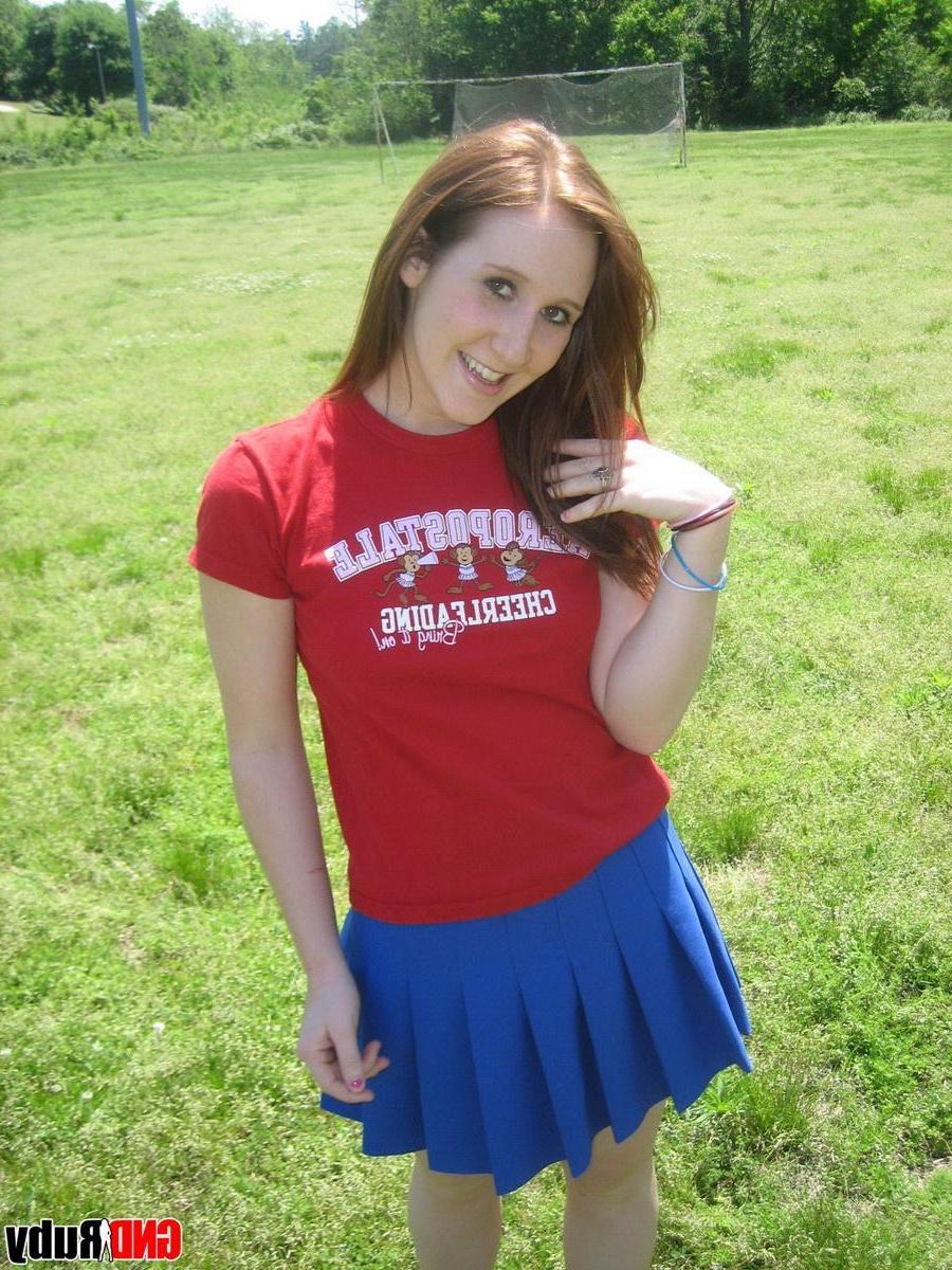 12P Teenage slut Ruby flashes her perky tits out in the park while picking flowers