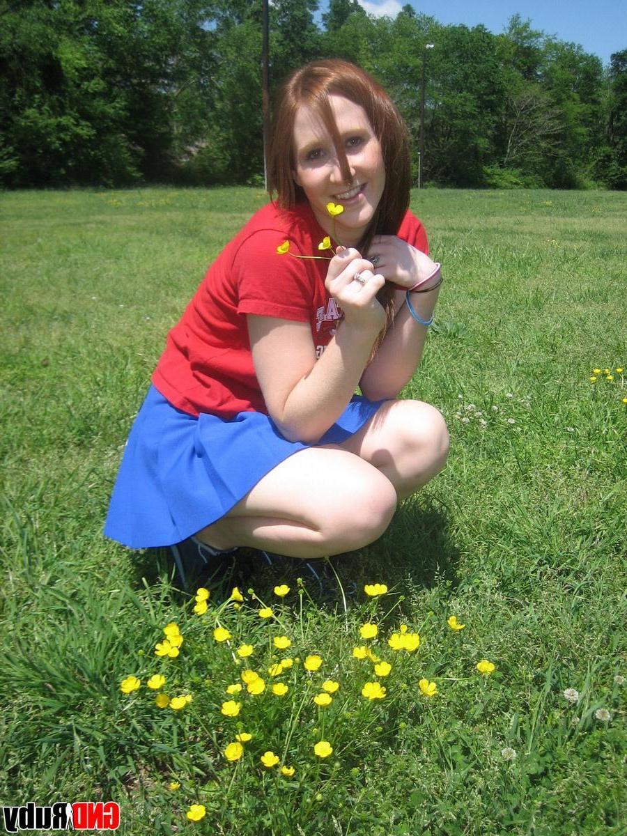 12P Teenage slut Ruby flashes her perky tits out in the park while picking flowers