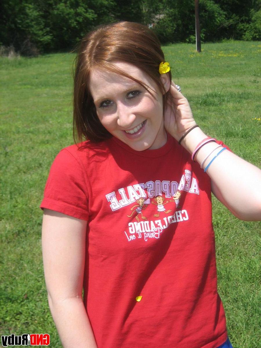 12P Teenage slut Ruby flashes her perky tits out in the park while picking flowers