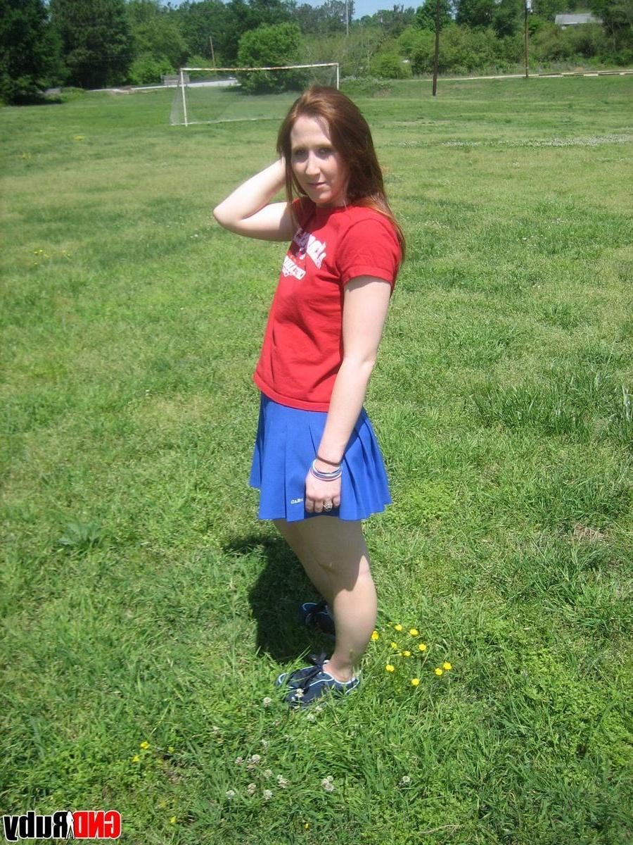 12P Teenage slut Ruby flashes her perky tits out in the park while picking flowers